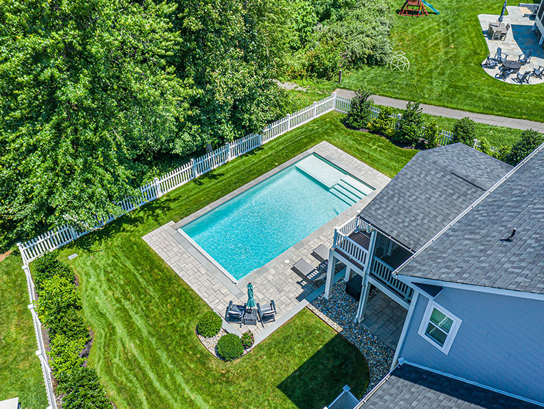 About section image featuring team and pool design expertise