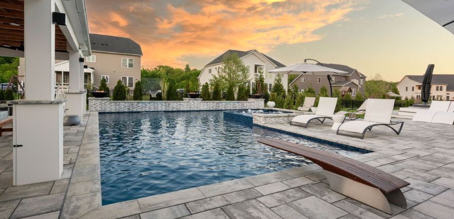 Luxury pool with updated finish, tile, coping, and outdoor seating in Northern Virginia